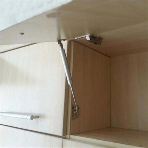 Soft Close Safety Hinges For Toy Box And Furniture Cabinets With Gas Spring Telescopic Rod Iron Head Design installed on a cabinet door