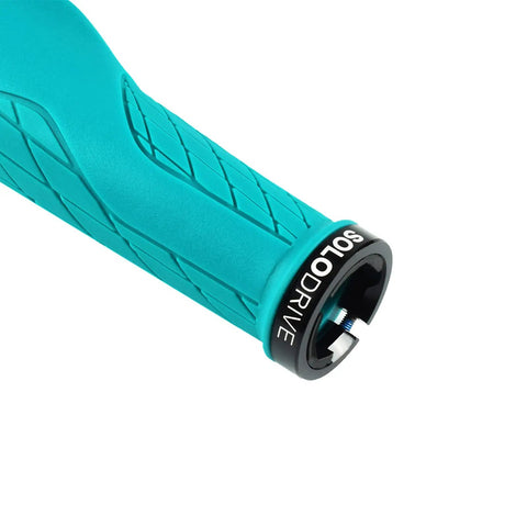 Close-up of turquoise ergonomic mountain bike grip with palm pad and non-slip texture, showcasing lock-on mechanism.