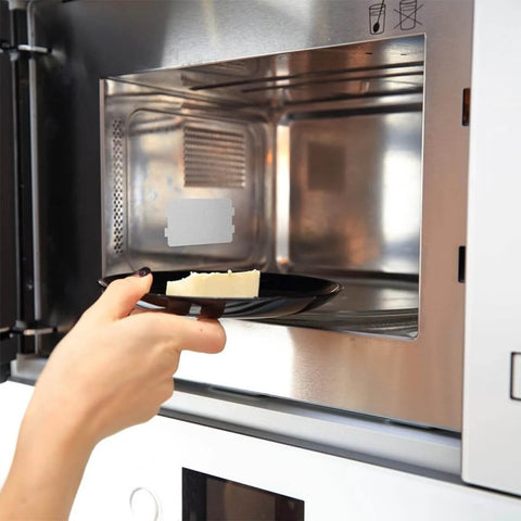 Placing a reusable microwave safe plate in oven, 12 Pcs Microwave Mica Plates Heat Resistant Insulation Sheets Anti Oil Pads visible inside