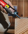 Individual applying Heavy Duty Construction Adhesive For Wood Concrete Stone And More Premium Max Strength Bond That Stays 100 Percent Solid After Curing In A 9 Oz Cartridge 1 Pack to wood surface.