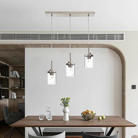 Black Island Pendant Lighting 5 Light Farmhouse Rectangle Linear Chandeliers With Clear Glass Shades hanging over dining table