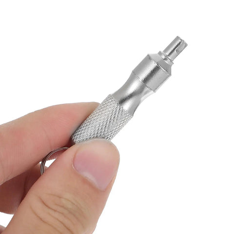 Close-up of hand holding 2 Pack Valve Core Removal Tool Keychain Stainless Steel Tire Valve Stem Tool Grab And Go Portable