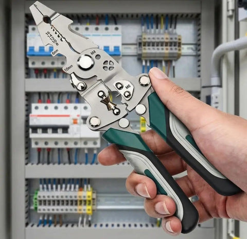 Hand holding Foldable Multifunctional Wire Stripper And Pliers Set With Crimper And Side Cutter in front of electrical panel