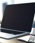 Slick Ergonomic Rubber Date Stamp With Comfortable Grip And Multifunctional Design For Scrapbooking And Office Documents next to a laptop on a desk.