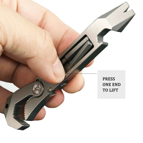 Hand holding EDC Titanium Multitool Pry Bar with Pocket Clip Mighty Bar Packs Wrench, Screwdriver, Nail Puller, Bottle Opener