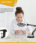 Person using 2 In 1 Clamp And Desk Magnifier Lamp With Dimmable LED Light Swivel Arm And 3 Color Modes for craft work
