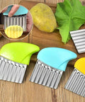 Four-piece stainless steel crinkle cutter set with bright plastic handles for vegetables.