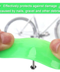 Two Pack Bike Tire Liners For Flat Protection, Bicycle Rim Tape And Rim Strip Protectors, hands holding green liner