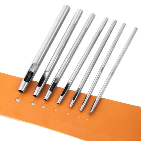 7 Piece Hollow Punch Set With Round Holes From 0.5mm To 5mm For Leather Craft Watch Bands And More displayed on orange leather
