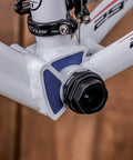 Close-up of a bicycle frame with attached Eight Notch Cartridge Bottom Bracket Lockring Tool 44mm OD Pro Grade Gearhead Favorite Install Remover