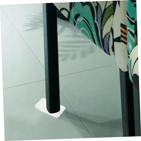 Heavy Duty Plastic Furniture Leveling Shims Adjustable Wedge Pack Stops Wobbly Tables Fast Ultra Smooth Home Upgrade Diy Floor Stabilizer Quick Fix Kit under a black chair leg on tile floor.