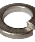 Close-up of split lock washer #8, 316 stainless steel, metallic gray finish