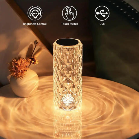 Lit Crystal Diamond Portable Table Lamp With 3 Color Touch Control on a table reflecting diamond-pattern light