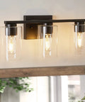 Four Light Matte Black Bathroom Vanity Light With Glass Shades Over Mirror Wall Sconces For Farmhouse Style Dope Modern Home Lighting Fixture Built From Rust Resistant Metal Durable Build, mounted above mirror with three lit bulbs