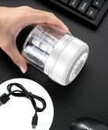 USB Rechargeable Electric Mini Garlic Chopper 100Ml Cordless Food Processor held in hand on black surface.