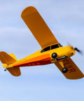 Champ Anniversary Edition 515mm RC Trainer Airplane BNF Basic with Safe Select in flight, factory preassembled, yellow design.