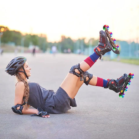 Person rollerblading outdoors wearing helmet and protective gear, showcasing Durable Inline Skate Wheels 64mm 24mm Wide With Pre Installed Bearings.