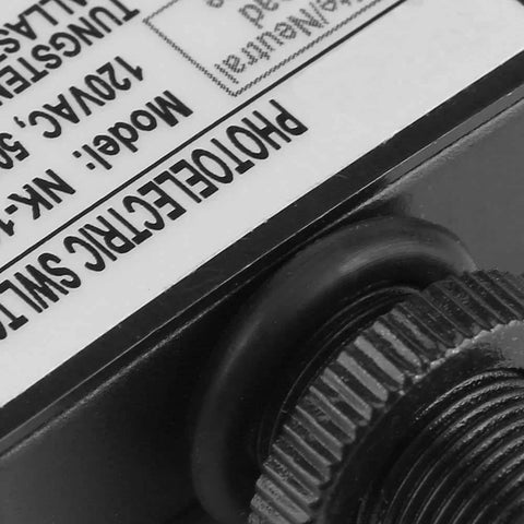 Close-up of Automatic Dusk To Dawn Photocell Switch With 120VAC Light Sensor detailing model NK-101A for indoor or outdoor use