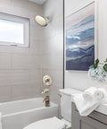 Bathroom scene with Gibson Posi Temp Valve Trim Kit Brushed Nickel With Metal Construction And Easy Adjust Lever.