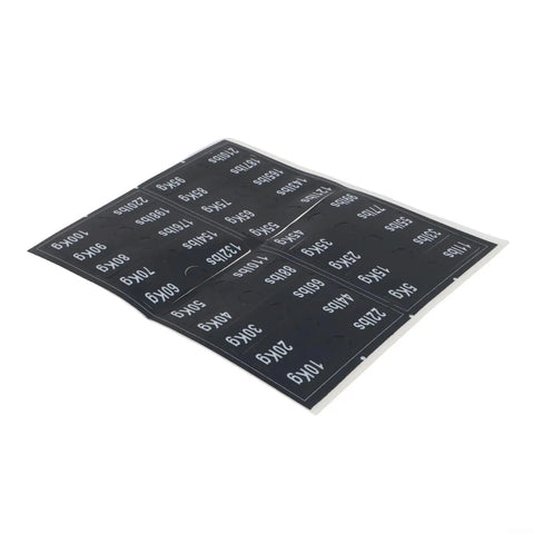 Weight Stack Labels for Gym Equipment Pack with Black Load Plate Decals on sheet shown at an angle.