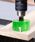 HLOFIZI 6-1/8in carbide-tipped hole saw with arbor installed on drill cutting wood