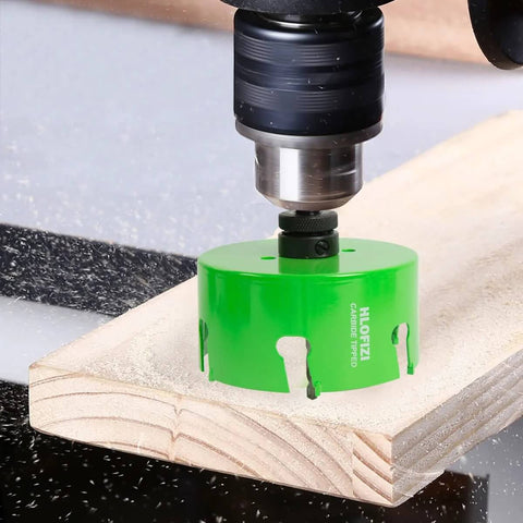 HLOFIZI 6-1/8in carbide-tipped hole saw with arbor installed on drill cutting wood