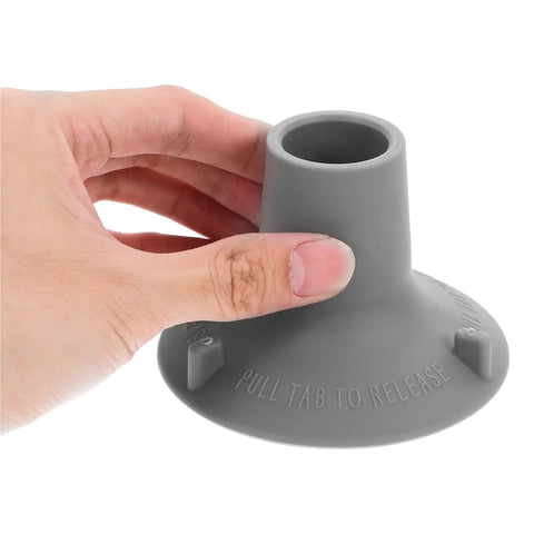Non Slip Shower Chair Foot Caps 12 Pack Heavy Duty TPR Pads held by hand, close-up view showing 'Pull Tab to Release' text