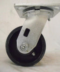 Side view of 4x2 in swivel caster with 7/8 in V-groove iron/steel wheel and mounting plate