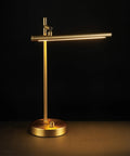 West 15 Inch LED Integrated Desk Lamp in matte brass with 200 lumens dimmer rotary switch, pivoting head visible