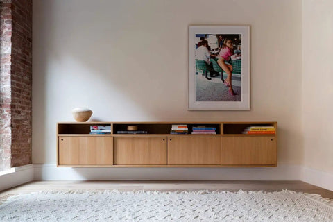 Contemporary living room with mounted cabinet and artwork on wall, featuring White Oak Rift Wood Veneer Sheet 24x48 Peel And Stick A Grade Veneer Face