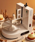 Pro Grade Cake Decorating Turntable With Smoothing Coating Machine For 6 To 14 Inch Cakes, AC110V, on kitchen counter with tools