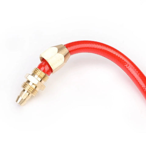 Close-up of Four Piece Solid Brass Reusable Fittings For One Quarter Inch ID PU Hose, showing connection to red hose end.