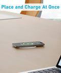 Slick Flush Mount Pop Up Socket Drops Straight Into Countertops Featuring Qi2 Magnetic Wireless Charger With 65W Fast Charging Double Usb Ports Zero Hassle Setup In Fresh White with smartphone charging on desk.