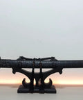 Solid Wood Sword Stand Display For Katana Wakizashi And Samurai Swords Black Finish Base Holder showcasing a sword on a desk