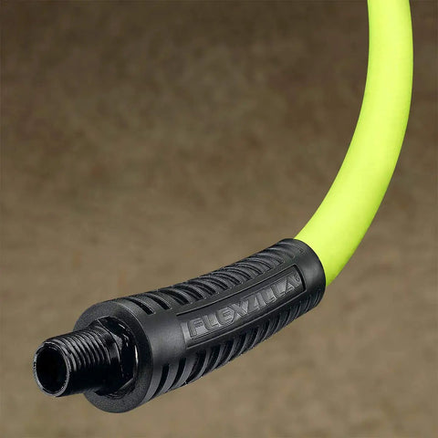 Close-up of a heavy duty air compressor hose 1/4 inch MNPT fitting, showing flexible green tubing for all weather durability.