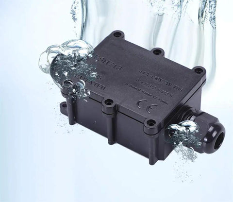 Waterproof Outdoor Junction Box IP68 With 3 Way M20 Cable Gland in water showcasing durability and weatherproof design