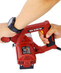 Close-up of a Heavy Duty Corded Toe Kick Circular Saw in a person's grip, showcasing ergonomic design for precision cabinet cuts.