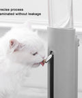 Height Adjustable 680 Ml Pet Water Dispenser And Automatic Food Feeder For Puppies Kittens And Rabbits Featuring Detachable Bowl Bite Resistant Design And Travel Sipping Fun For Your Fur Babies At Home Or On Road Trips with a cat using the roller nozzle.