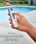 Telis 1 Patio Remote For Outdoor Blinds And Shades, All Weather Single Channel Handheld Controller in hand by a pool