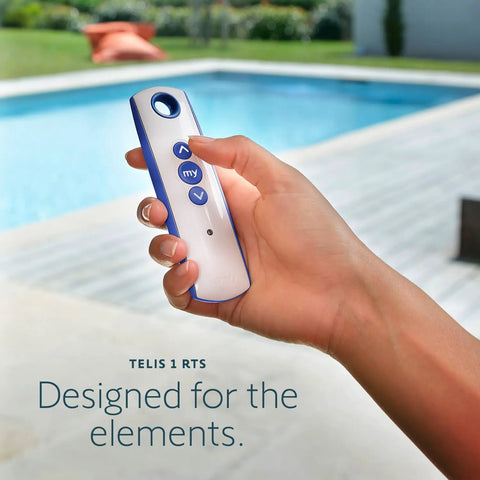 Telis 1 Patio Remote For Outdoor Blinds And Shades, All Weather Single Channel Handheld Controller in hand by a pool