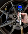 Person using FlowPro 2.0 Digital Tire Inflator With Pressure Gauge 200 PSI ANSI Grade 1A Accuracy Reads 0.10 PSI Increments on car tire