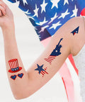 Arm decorated with Fourth Of July Temporary Tattoos 90 Piece Set With Patriotic American Flag Fireworks Eagles Red White Blue Fake Tattoo Stickers