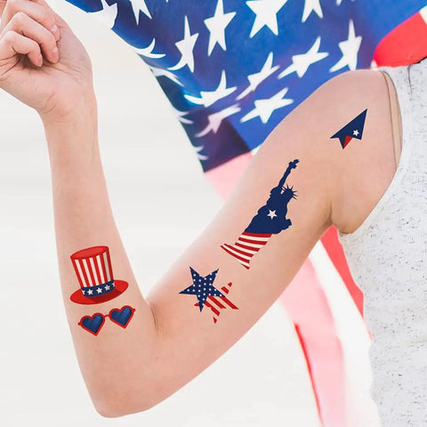 Arm decorated with Fourth Of July Temporary Tattoos 90 Piece Set With Patriotic American Flag Fireworks Eagles Red White Blue Fake Tattoo Stickers