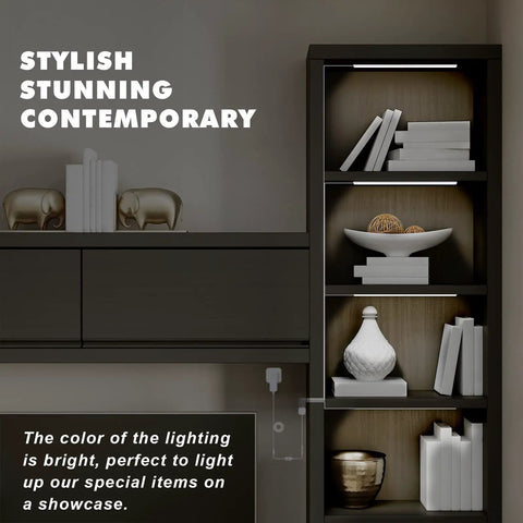 Four Pack Cold White LED Shelf Lights With Memory Function, illuminating a cabinet with decorative items on shelves.