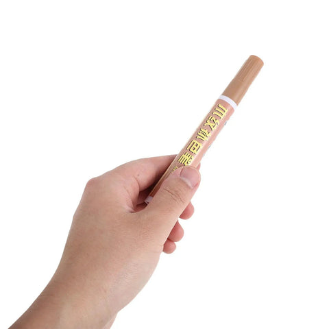 Hand holding 5 Piece Wood Repair Markers Touch Up Kit For Furniture Floors And Cabinets With 5 Colors Scratch Repair Pens