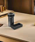 Heavy Lifter Graphite Crucible And Metal Smelting Mold Set With Integrated Oil Traps on a workbench for metal casting and refining.