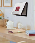 Heavy Duty Gas Spring Hinge For Cabinets With 40N Support in use on framed artwork in a cozy home setting