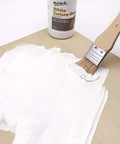 Brush applying Premium White Texture Gesso 250ml For Artists Pro Grade Primer For Acrylic, Oil, Pencils, Pastels, Graphite And Charcoal