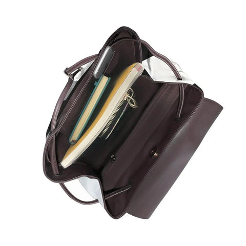 Inside view of Kick Up Your Daily Fit With This Slick Black And White Piano Grid Womens Leather Backpack featuring spacious storage.