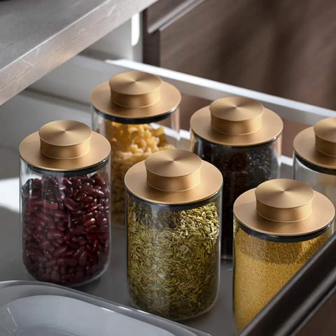 Top Notch Slick Large Glass Kitchen Jars Set Of Four Aluminum Lids filled with beans and spices organized in a drawer.